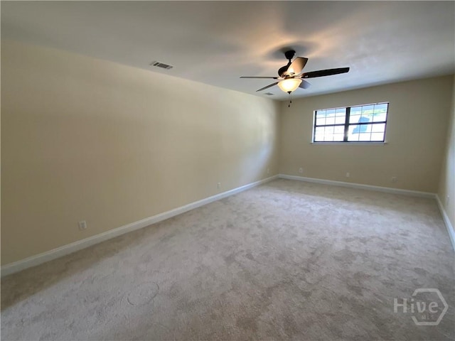 61 Port Dr, Richmond Hill, GA 31324 - empty room featuring a ceiling fan, light carpet, and baseboards