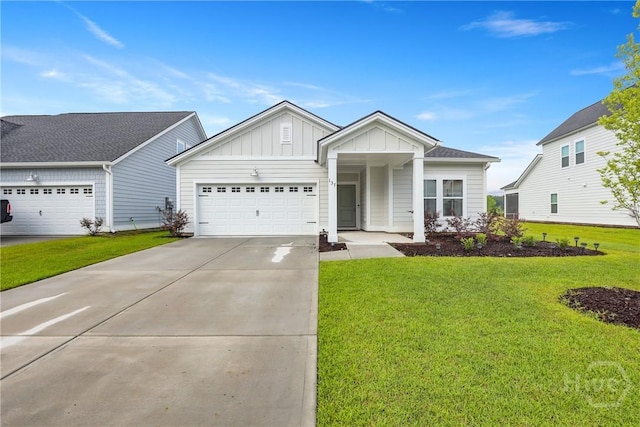 137 Binscombe Ln, Pooler, GA 31322 - view of front of house with board and batten siding, a garage, driveway, and a front lawn