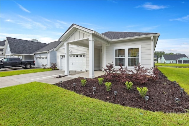 137 Binscombe Ln, Pooler, GA 31322 - ranch-style home featuring a front lawn, a garage, driveway, and board and batten siding