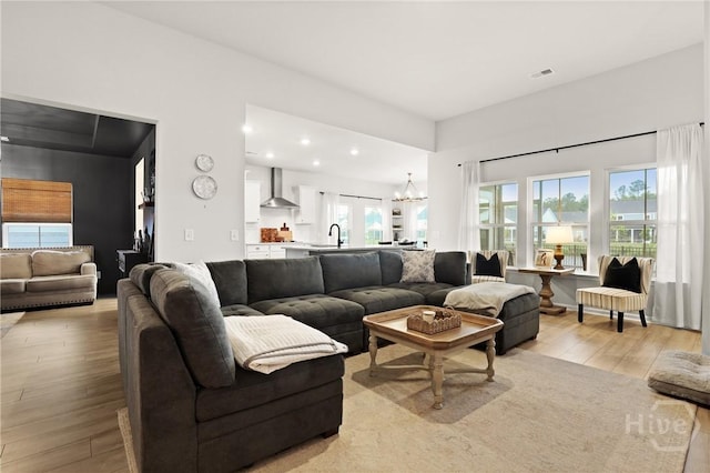 137 Binscombe Ln, Pooler, GA 31322 - living area featuring light wood-style flooring, a chandelier, and recessed lighting