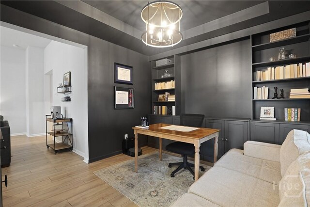 137 Binscombe Ln, Pooler, GA 31322 - office featuring built in shelves, light wood-style floors, a chandelier, baseboards, and a tray ceiling