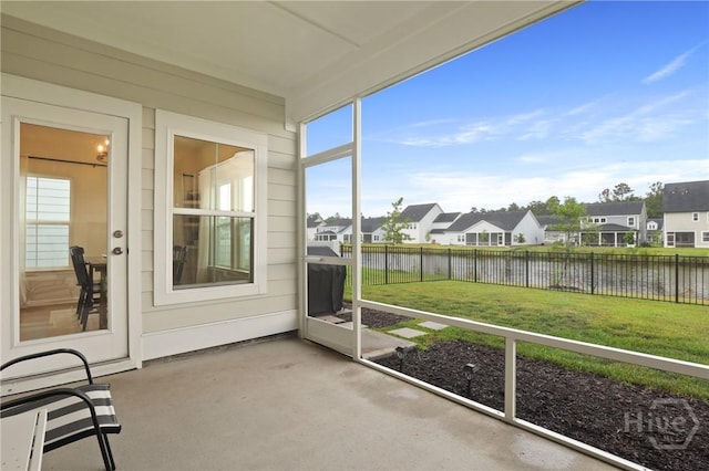137 Binscombe Ln, Pooler, GA 31322 - unfurnished sunroom with a water view, a residential view, and healthy amount of natural light