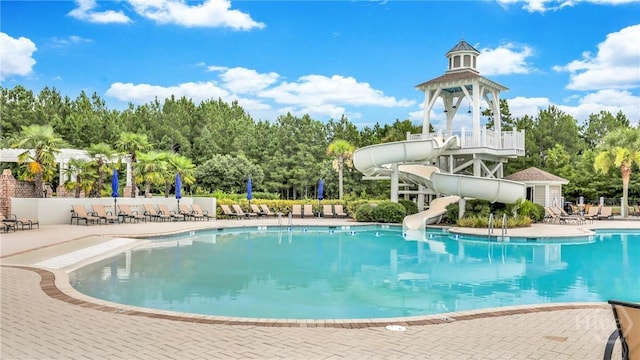137 Binscombe Ln, Pooler, GA 31322 - community pool featuring a water slide, view of scattered trees, and a patio