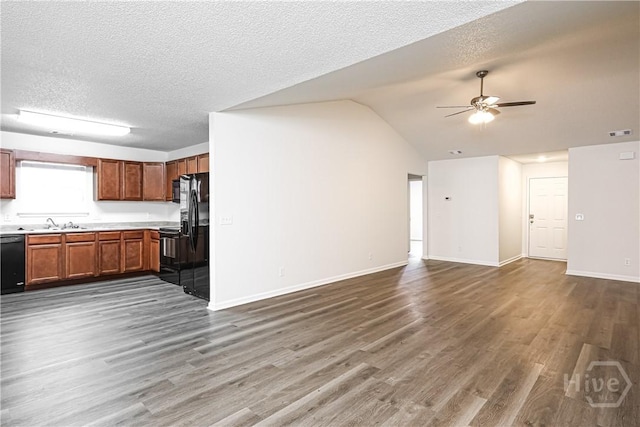 42 Tiller Way, Port Wentworth, GA 31407 - unfurnished living room with a ceiling fan, wood finished floors, a textured ceiling, and vaulted ceiling