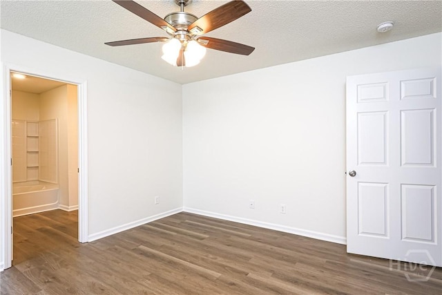 42 Tiller Way, Port Wentworth, GA 31407 - empty room with dark wood-style floors, a smoke detector, ceiling fan, and a textured ceiling