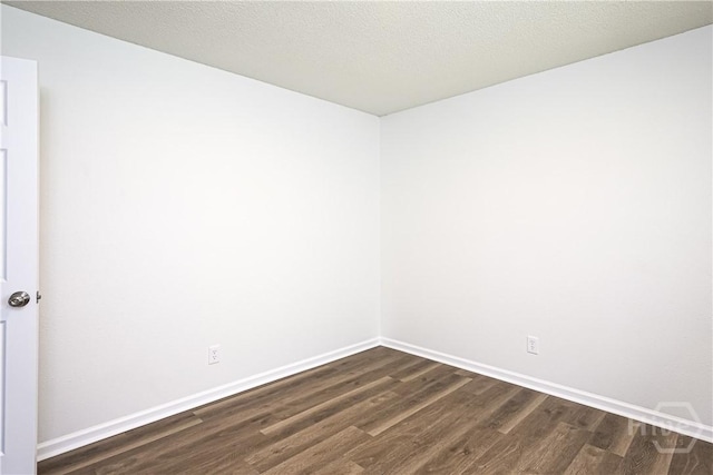 42 Tiller Way, Port Wentworth, GA 31407 - empty room featuring dark wood finished floors and baseboards