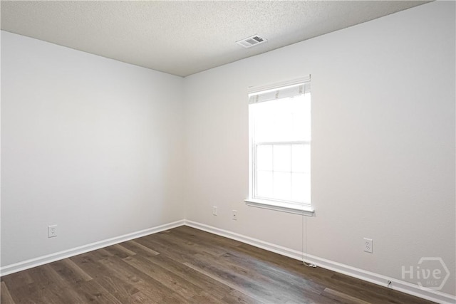 42 Tiller Way, Port Wentworth, GA 31407 - unfurnished room with dark wood-style floors and a textured ceiling