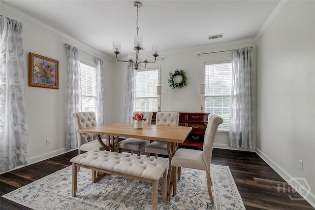 101 Sabal Ln, Savannah, GA 31405 - dining area with healthy amount of natural light, a chandelier, crown molding, dark wood-type flooring, and baseboards