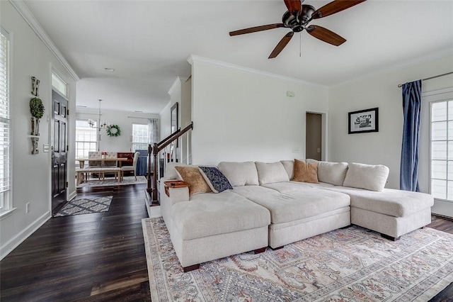 101 Sabal Ln, Savannah, GA 31405 - living area featuring dark wood finished floors, ornamental molding, ceiling fan, baseboards, and stairway