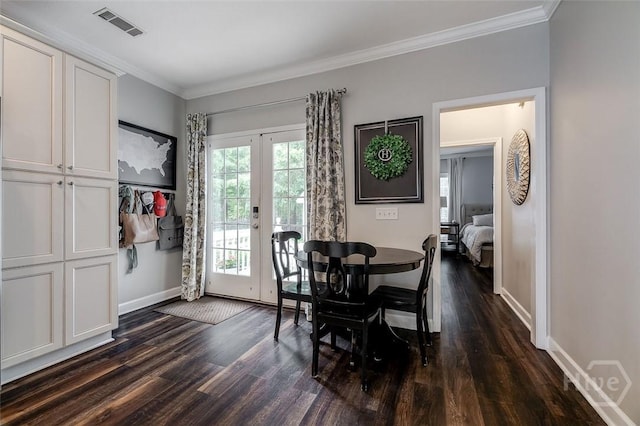 101 Sabal Ln, Savannah, GA 31405 - dining area featuring dark wood finished floors, french doors, baseboards, and crown molding