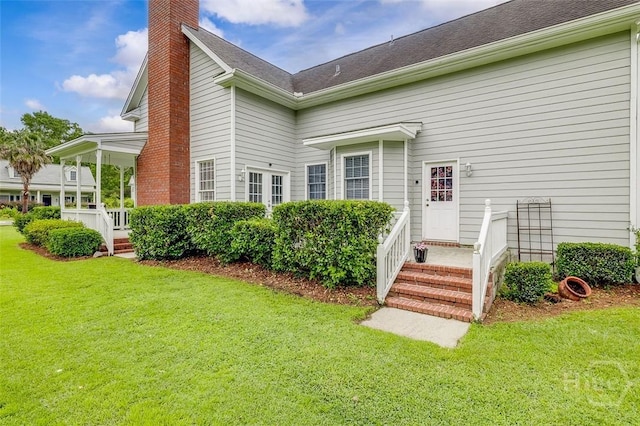 101 Sabal Ln, Savannah, GA 31405 - rear view of house with a chimney and a yard