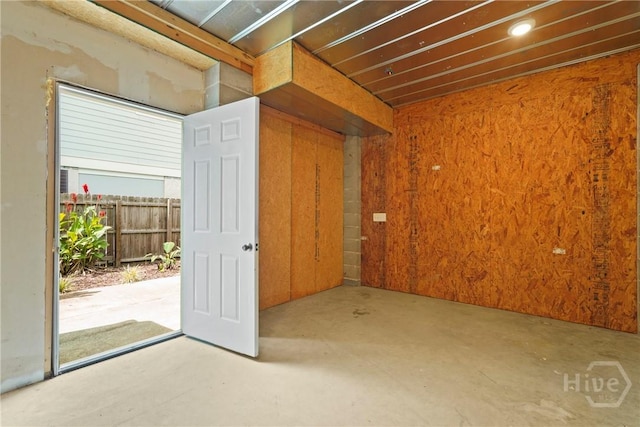 132 Pelican Dr, Tybee Island, GA 31328 - empty room with concrete flooring