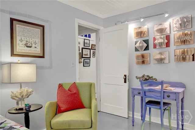 14 Bright St, Tybee Island, GA 31328 - sitting room featuring rail lighting and baseboards