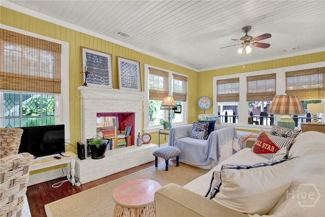 14 Bright St, Tybee Island, GA 31328 - living area with crown molding, ceiling fan, a brick fireplace, and wood finished floors