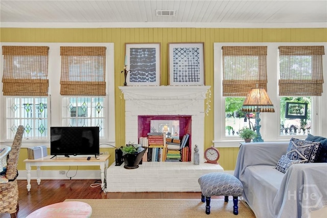 14 Bright St, Tybee Island, GA 31328 - living room with wood finished floors and a brick fireplace