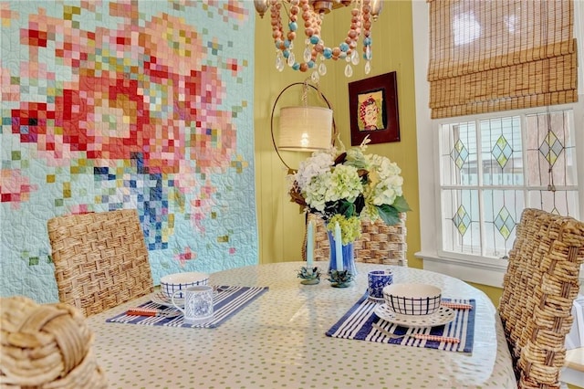 14 Bright St, Tybee Island, GA 31328 - dining room featuring plenty of natural light and a chandelier