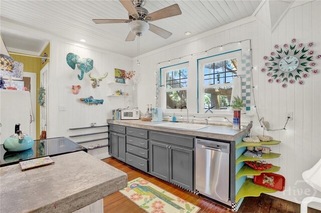 14 Bright St, Tybee Island, GA 31328 - kitchen with dishwasher, gray cabinetry, a sink, light wood-style floors, and open shelves