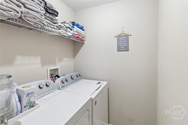 2000 Ossabaw Dr, Hinesville, GA 31313 - laundry area with separate washer and dryer and a textured ceiling