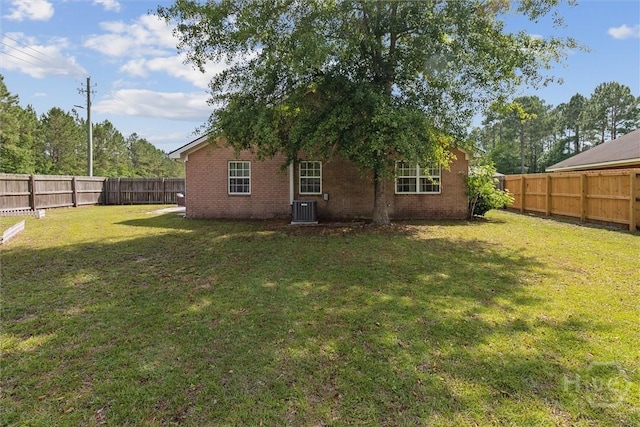 2000 Ossabaw Dr, Hinesville, GA 31313 - back of house with brick siding and central AC unit