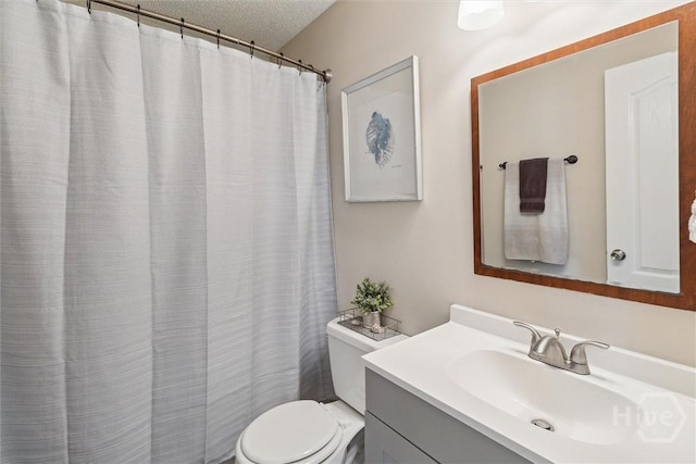 2000 Ossabaw Dr, Hinesville, GA 31313 - full bathroom featuring toilet, vanity, a textured ceiling, and a shower with shower curtain