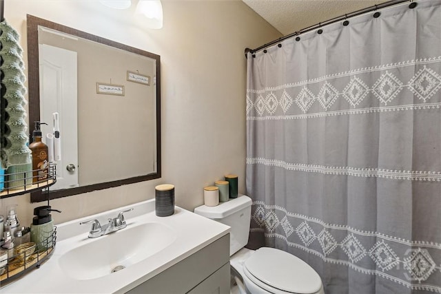 2000 Ossabaw Dr, Hinesville, GA 31313 - full bath featuring vanity, toilet, a textured ceiling, and a shower with curtain