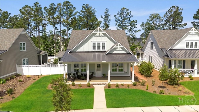 117 Quince St, Pooler, GA 31322 - view of front of home with board and batten siding, covered porch, metal roof, a shingled roof, and a standing seam roof