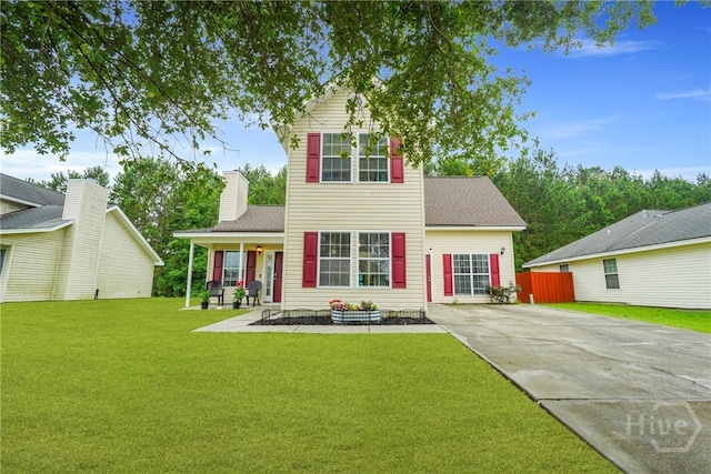 21 Hawser Way, Port Wentworth, GA 31407 - traditional-style house featuring a front lawn, a porch, driveway, and a shingled roof