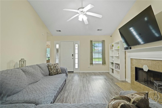 21 Hawser Way, Port Wentworth, GA 31407 - living area with vaulted ceiling, a ceiling fan, wood finished floors, baseboards, and a tiled fireplace