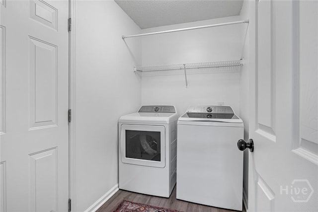 231 Tigers Paw Dr, Pooler, GA 31322 - laundry area featuring washing machine and dryer, dark wood-style floors, a textured ceiling, and baseboards