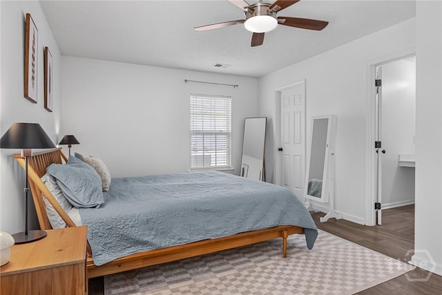 231 Tigers Paw Dr, Pooler, GA 31322 - bedroom with wood finished floors, baseboards, and ceiling fan