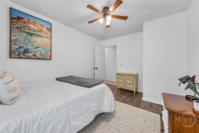231 Tigers Paw Dr, Pooler, GA 31322 - bedroom featuring wood finished floors, ceiling fan, and baseboards