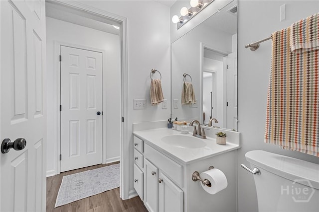 231 Tigers Paw Dr, Pooler, GA 31322 - bathroom featuring vanity, toilet, and wood finished floors