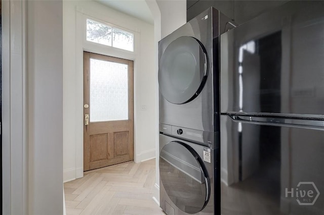316 W 38th St, Savannah, GA 31401 - washroom featuring stacked washer / dryer and baseboards