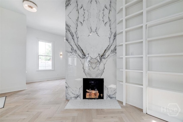 316 W 38th St, Savannah, GA 31401 - unfurnished living room with a premium fireplace and baseboards