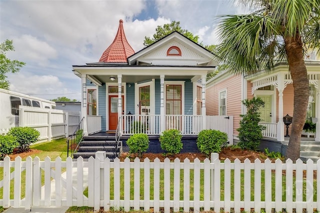 316 W 38th St, Savannah, GA 31401 - victorian home with covered porch and a fenced front yard