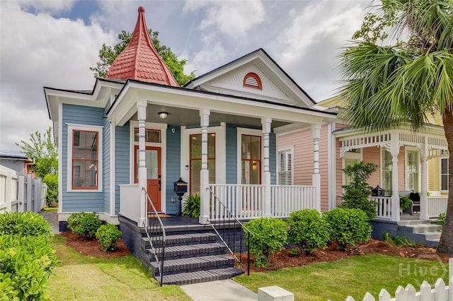 316 W 38th St, Savannah, GA 31401 - shotgun-style home featuring covered porch