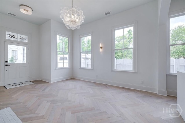 316 W 38th St, Savannah, GA 31401 - foyer with a chandelier and baseboards