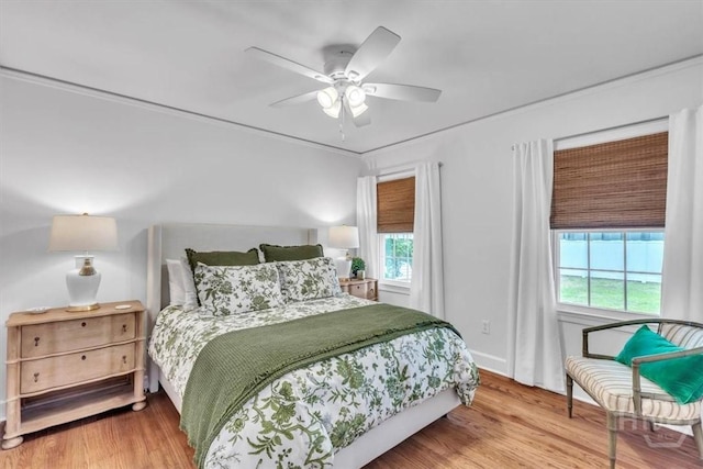2117 E 42nd St, Savannah, GA 31404 - bedroom with multiple windows, wood finished floors, and a ceiling fan