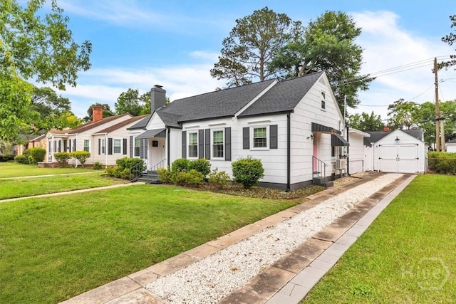 2117 E 42nd St, Savannah, GA 31404 - view of front of home featuring concrete driveway, an outbuilding, a detached garage, and a front lawn