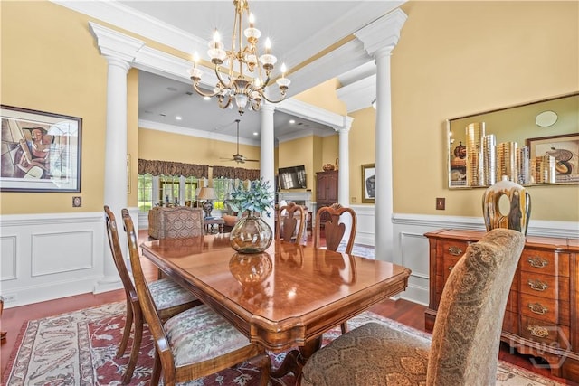 312 Spanton, Pooler, GA 31322 - dining space featuring ornate columns, crown molding, a chandelier, a wainscoted wall, and a decorative wall