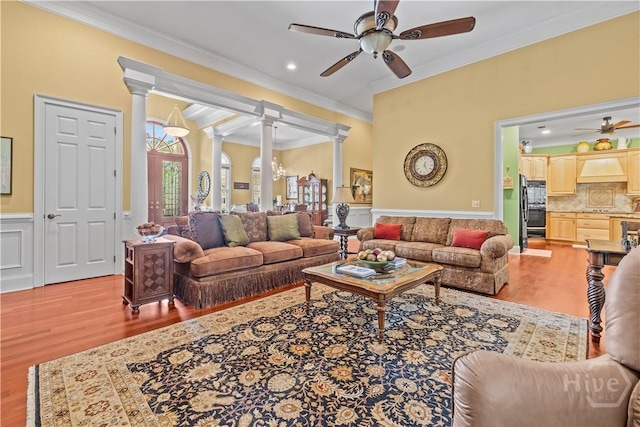 312 Spanton, Pooler, GA 31322 - living area featuring ornamental molding, light wood-style floors, decorative columns, ceiling fan, and wainscoting