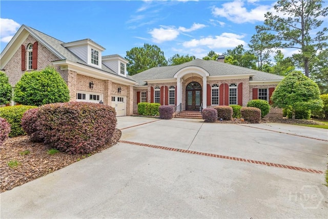 312 Spanton, Pooler, GA 31322 - view of front of home with brick siding, concrete driveway, french doors, and a chimney