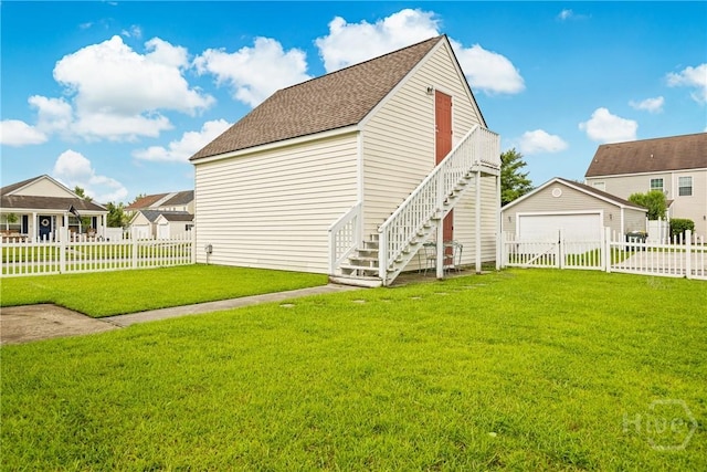 1 Westbourne Way, Savannah, GA 31407 - rear view of house featuring stairway, a detached garage, an outbuilding, and roof with shingles