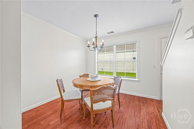 1 Westbourne Way, Savannah, GA 31407 - dining room with a chandelier, crown molding, wood finished floors, and baseboards