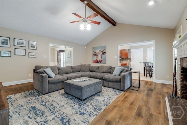 103 W Gazebo Ln, Savannah, GA 31410 - living area featuring wood finished floors, a ceiling fan, a brick fireplace, and baseboards