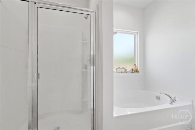 208 Cherokee Oaks Xing, Hinesville, GA 31313 - full bath featuring a stall shower and a garden tub