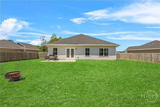 208 Cherokee Oaks Xing, Hinesville, GA 31313 - rear view of house with french doors, an outdoor fire pit, and a patio area