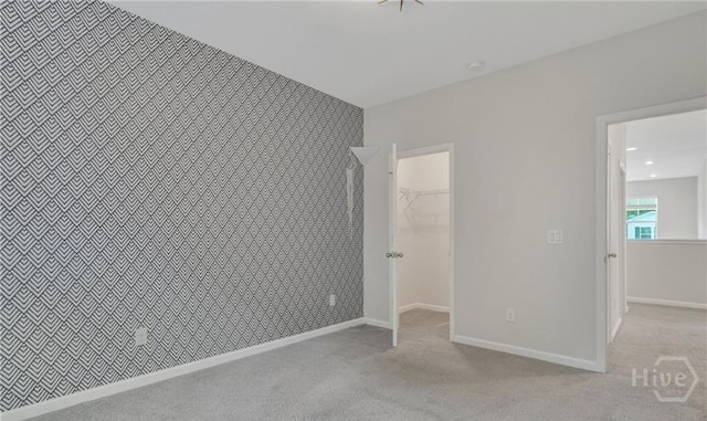 20 Lower Creek Dr, Richmond Hill, GA 31324 - unfurnished bedroom featuring a walk in closet, carpet floors, a closet, and baseboards