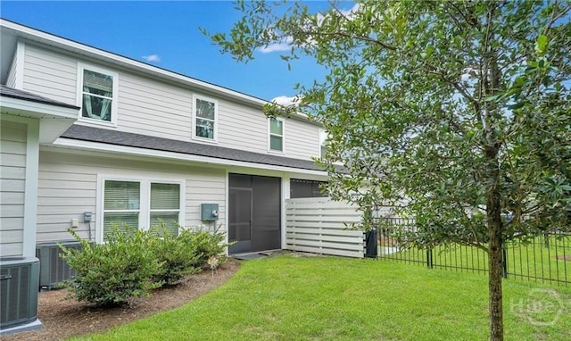 20 Lower Creek Dr, Richmond Hill, GA 31324 - back of house with central AC and a shingled roof