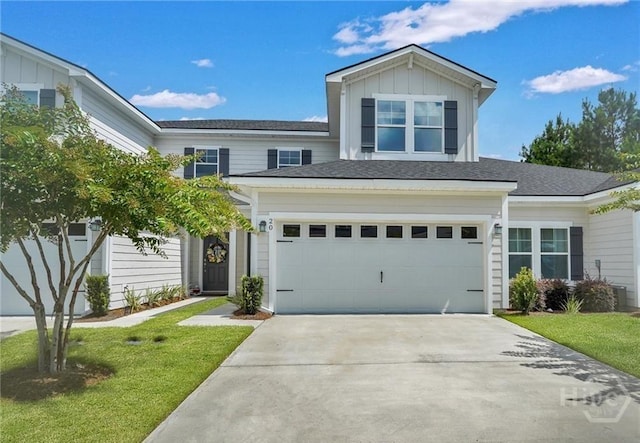 20 Lower Creek Dr, Richmond Hill, GA 31324 - traditional-style home featuring concrete driveway, an attached garage, a front yard, and board and batten siding